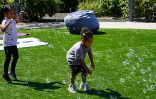 Kids playing with with bubbles